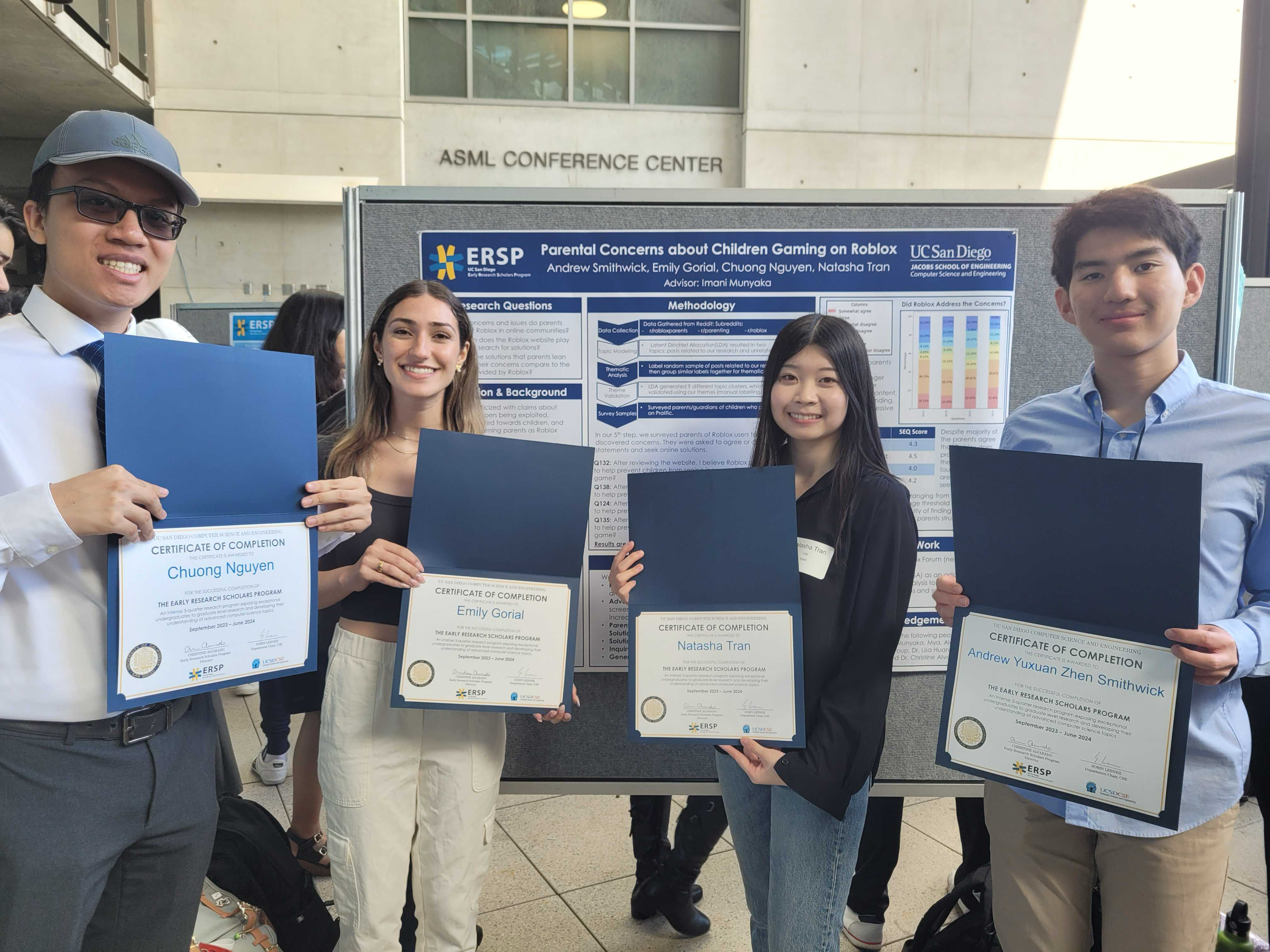 Four students in front of research poster holding up completion awards